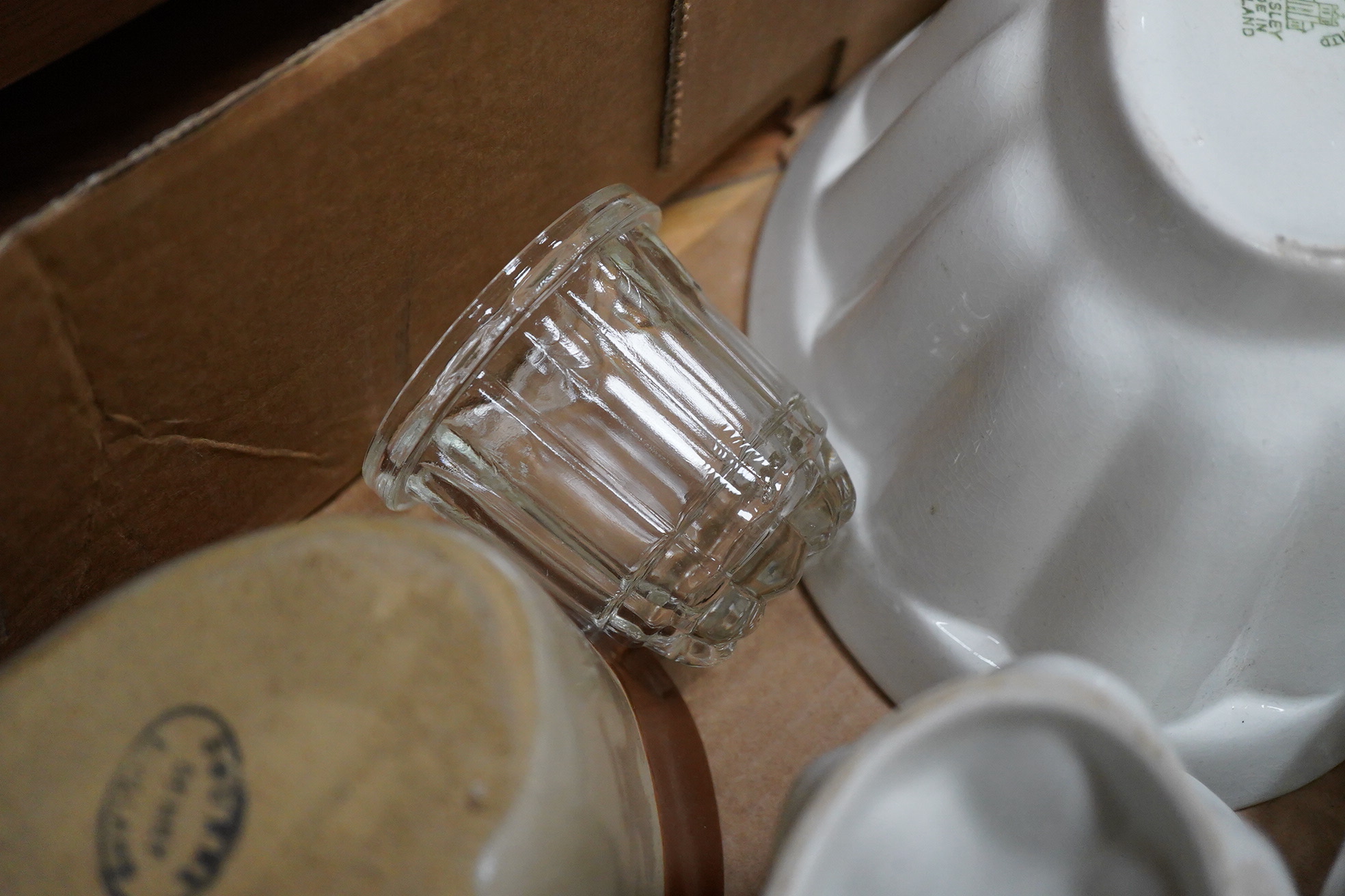 A collection of mostly Victorian ceramic and later glass and metal jelly moulds